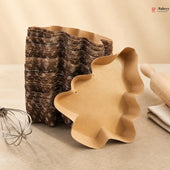 Decorative wavy-edged bowls on a neutral background with a whisk and folded fabric.