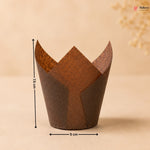 Brown cupcake liner with measurements on a beige background