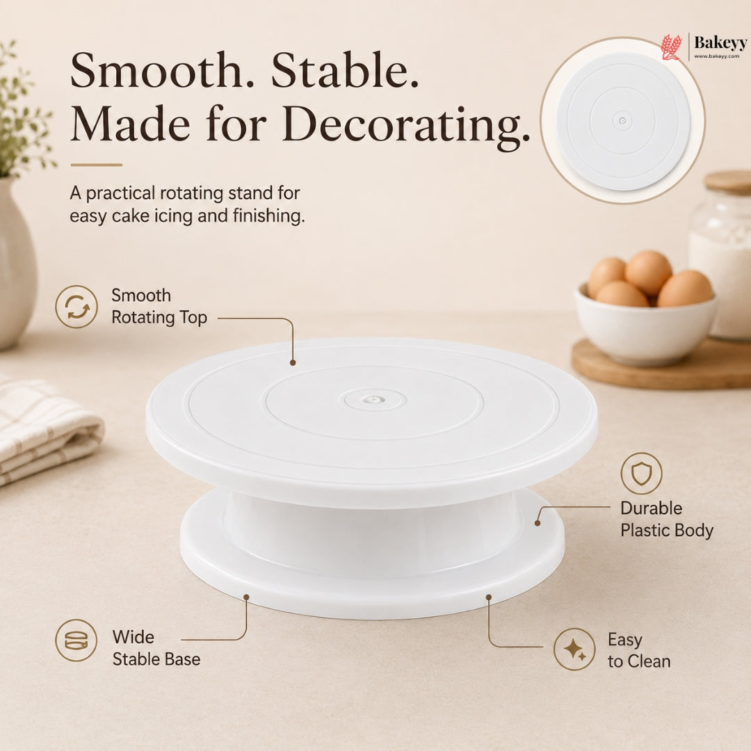 White cake decorating turntable with features highlighted on a beige background
