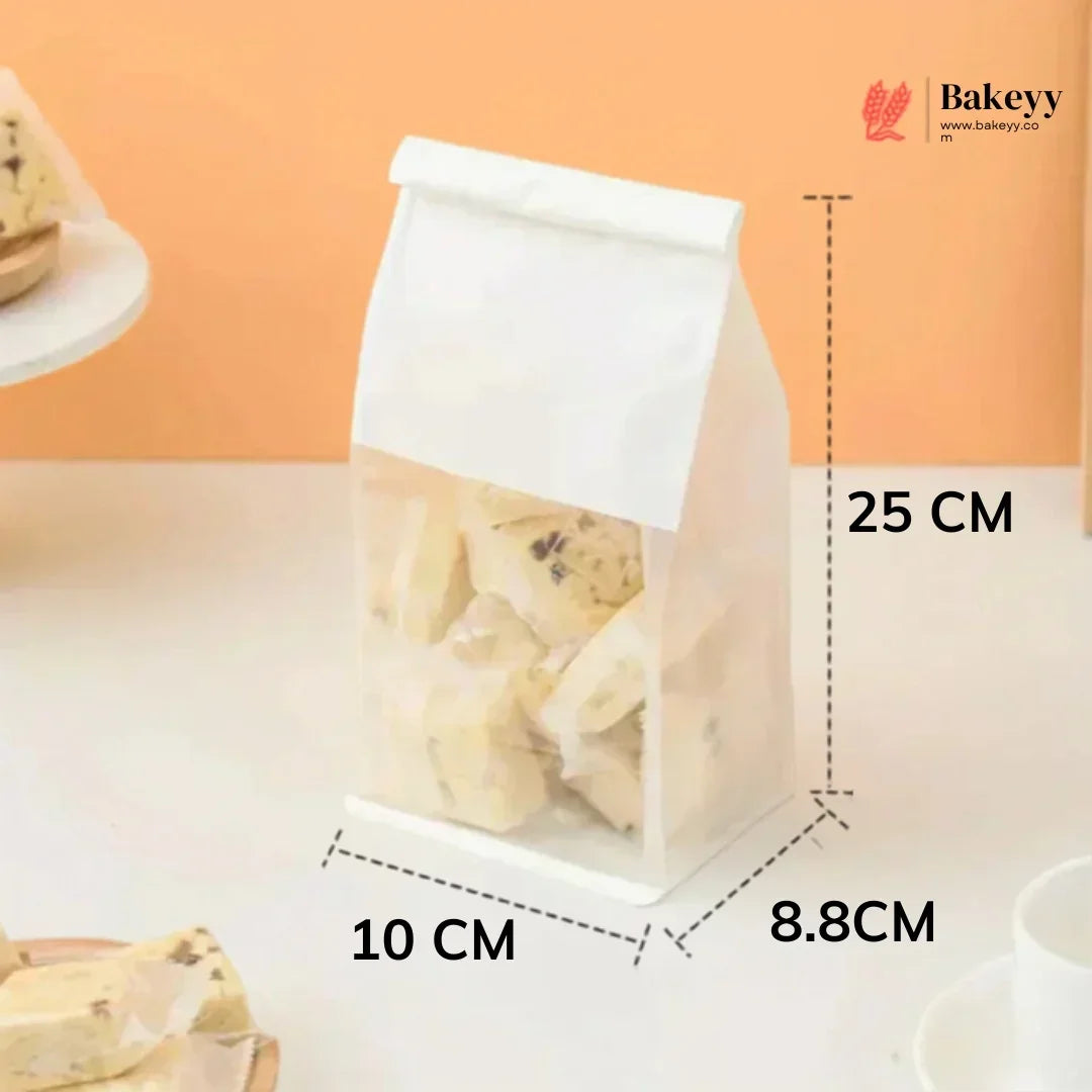 Clear plastic bag with cookies, labeled dimensions, and Bakeyy branding.