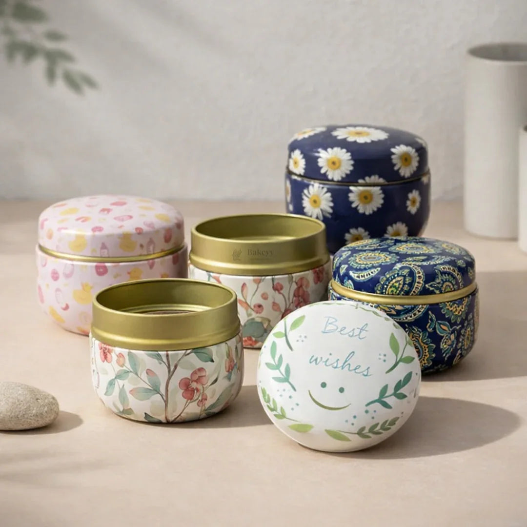 Decorative gift packaging tins with floral and festive designs from Bakeyy.com on display table