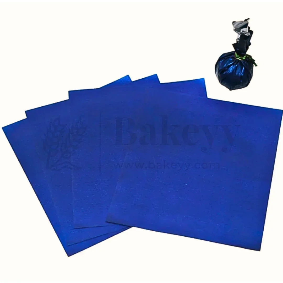 Blue wrapping sheets for bakery gift packaging from Bakeyy, displayed with a wrapped item.