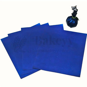 Blue wrapping sheets for bakery gift packaging from Bakeyy, displayed with a wrapped item.