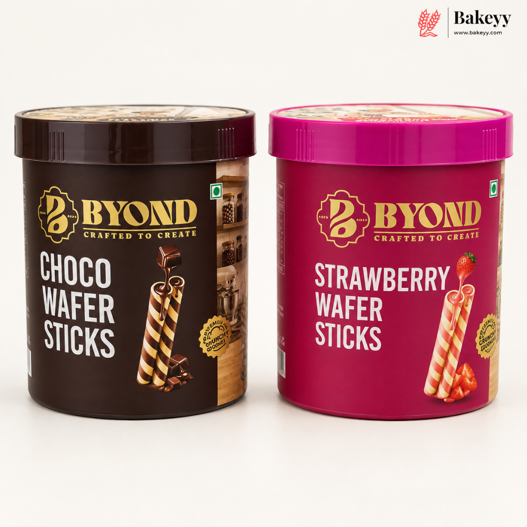 Two BYOND branded wafer stick tubs on a white background: Choco Wafer Sticks in a dark brown container and Strawberry Wafer Sticks in a magenta-pink container. The Bakeey website logo appears in the top right corner.