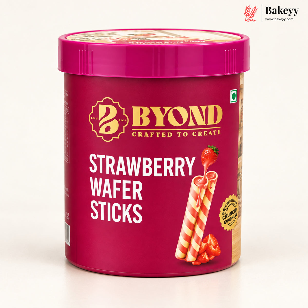 A tub of BYOND Strawberry Wafer Sticks on a clean white background. The packaging is a deep magenta pink with gold and white branding, and an illustration of two striped wafer sticks with a strawberry on top.