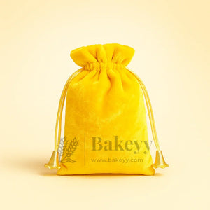 Yellow velvet potli gift bag with drawstring, wholesale gift packaging from Bakeyy.com