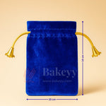 Blue velvet potli gift bag with gold drawstrings, 10x14 cm, from Bakeyy gift packaging.
