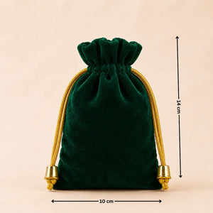 Green velvet drawstring pouch with gold accents and measurements on a beige background
