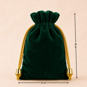 Green velvet drawstring pouch with gold accents and measurements on a beige background