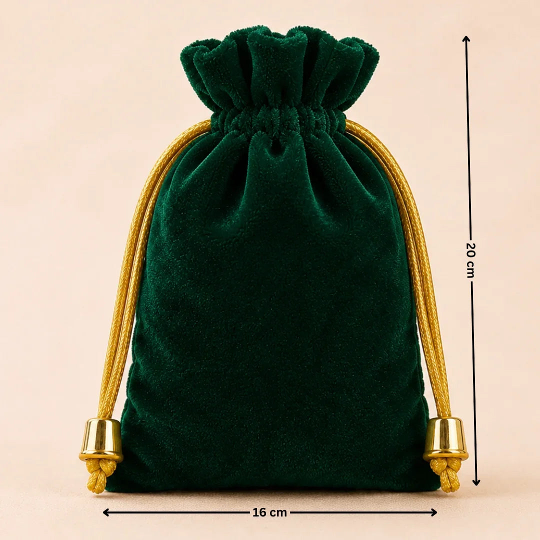 Green velvet drawstring bag with gold accents and measurements on a beige background