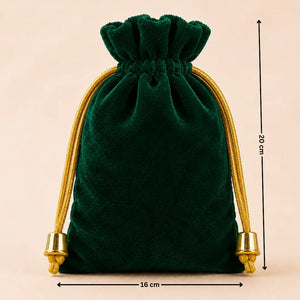 Green velvet drawstring bag with gold accents and measurements on a beige background