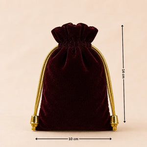 Burgundy velvet drawstring pouch with gold accents and measurements on a beige background