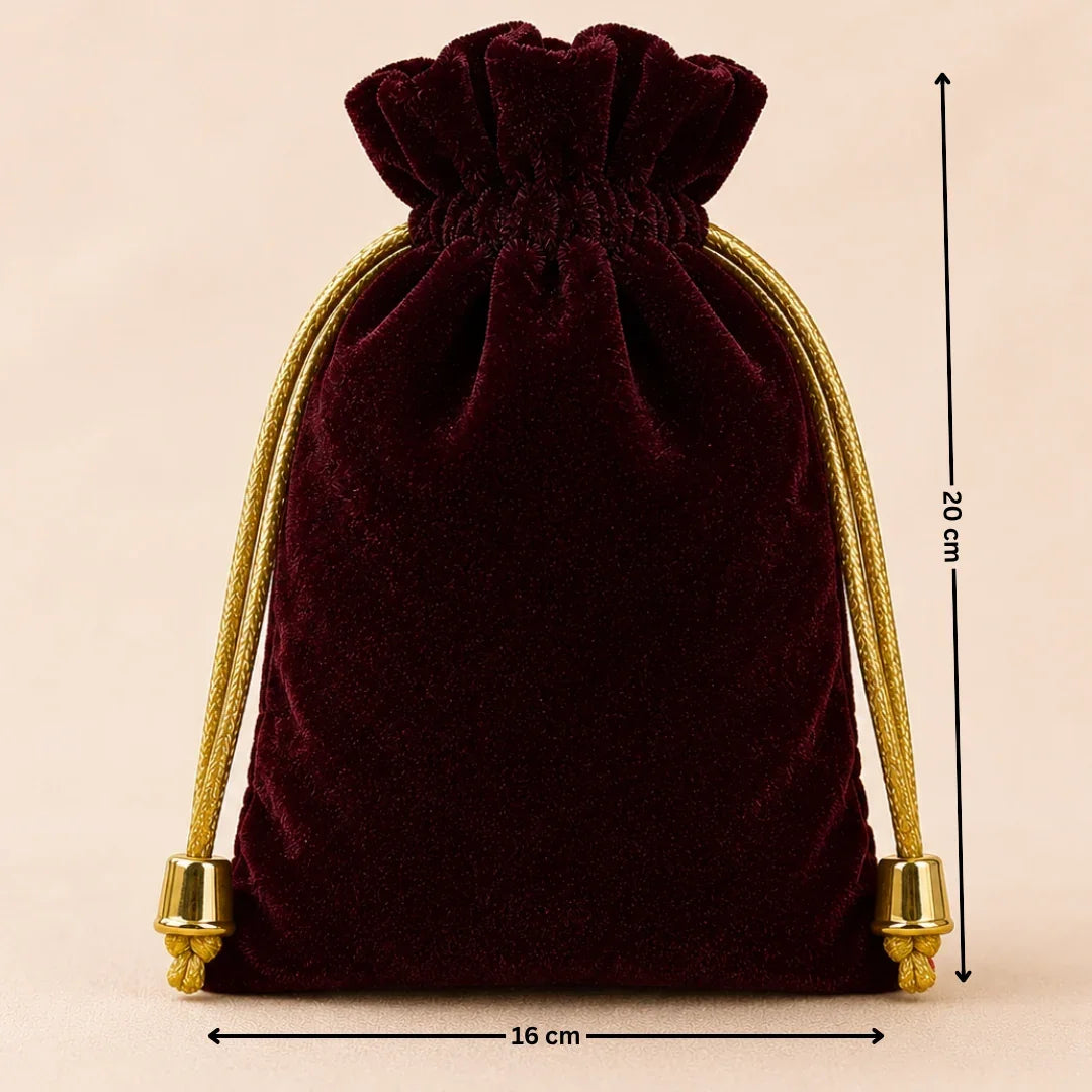 Velvet drawstring bag with gold accents and measurements on a beige background
