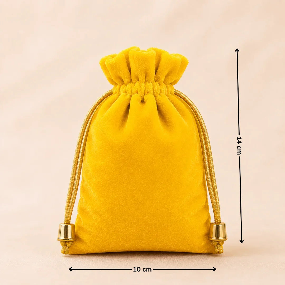 Yellow velvet drawstring bag with measurements on a beige background
