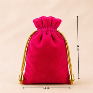Pink velvet drawstring bag with gold accents and measurements on a beige background
