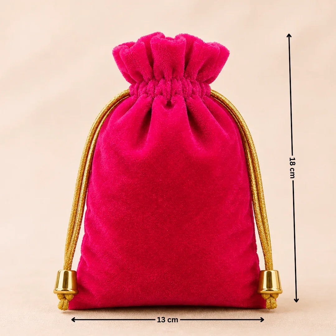 Pink velvet drawstring bag with gold accents and measurements on a beige background