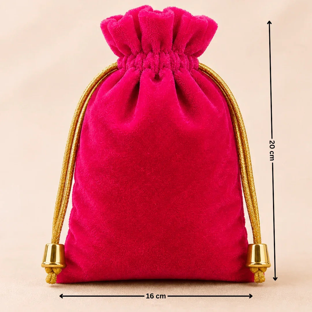 Pink velvet drawstring bag with gold tassels and measurements on a beige background