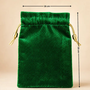Green velvet drawstring pouch with measurements on a beige background