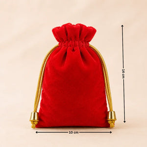 Red velvet drawstring pouch with gold accents and measurements on a beige background