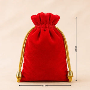 Red velvet drawstring pouch with gold accents and measurements on a beige background