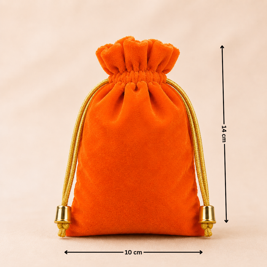 Orange velvet drawstring pouch with gold accents and measurements on a beige background