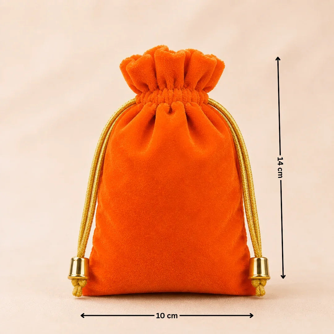 Orange velvet drawstring pouch with gold accents and measurements on a beige background