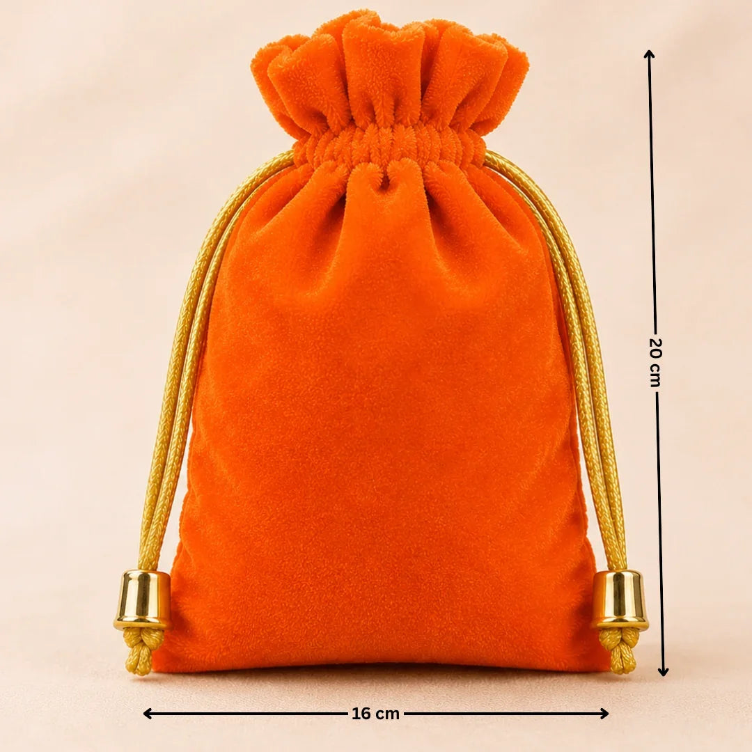Orange velvet drawstring bag with gold accents on a beige background, showing dimensions.