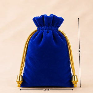 Blue velvet drawstring pouch with gold accents and measurements on a beige background