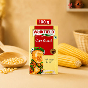 Weikfield corn starch packaging with corn and corn kernels on a wooden surface