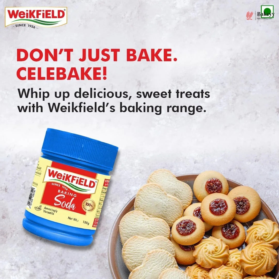 Weikfield baking soda container with cookies on a plate against a light gray background