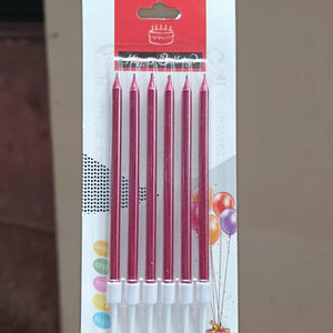 Pack of six birthday candles in a red metallic finish, sealed in a clear plastic sleeve and attached to a white cardboard backing with a red header card.
