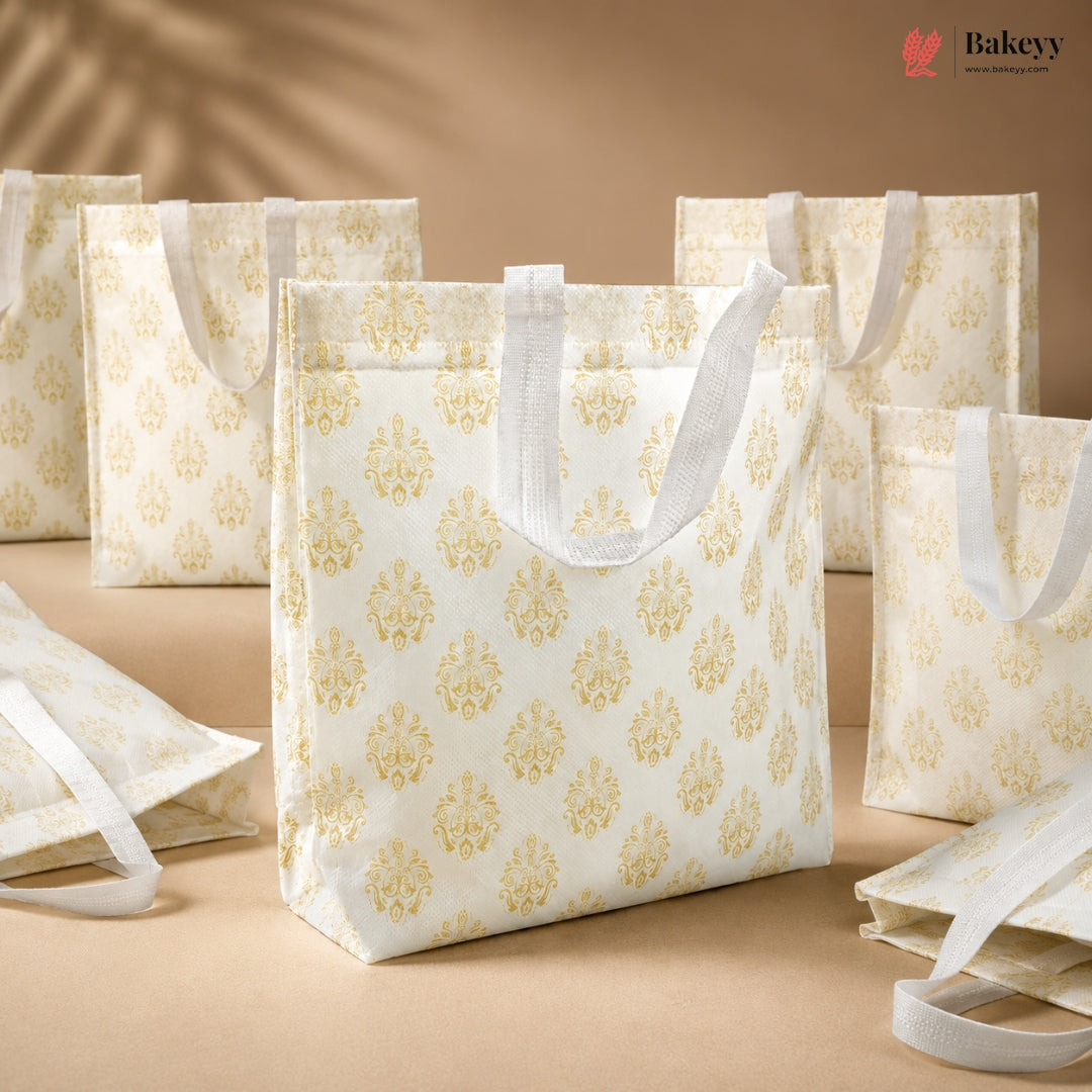 White tote bags with gold patterns on a beige background, featuring the Bakey brand.