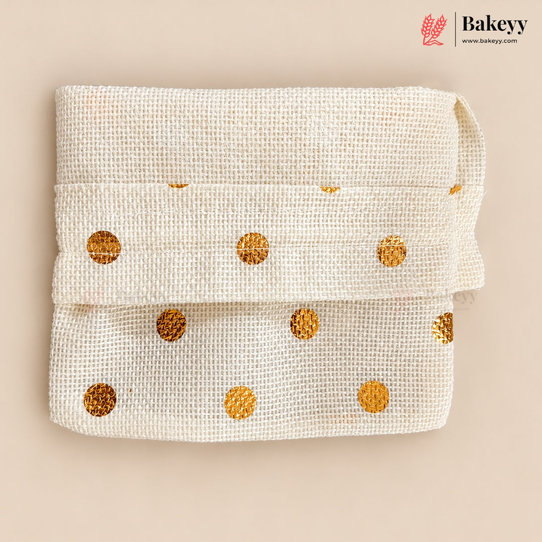 A folded cream-colored woven fabric band with shiny gold polka dots, displayed on a solid beige background. The Bakeey brand logo is visible in the top right corner.