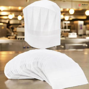 White chef's hat and apron on a stand in a kitchen setting