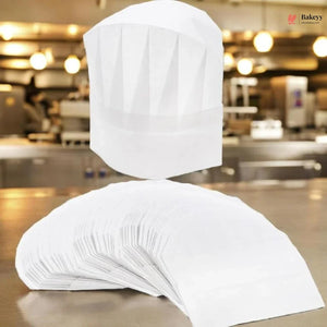 White chef's hat and apron on a stand in a kitchen setting