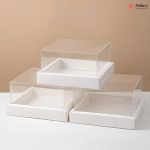 White display box with clear acrylic lid on a beige background