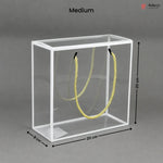 Clear cube with yellow rope inside, dimensions labeled, on a gray background