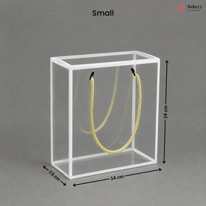 Small clear cube with yellow rope inside, dimensions labeled, on a gray background