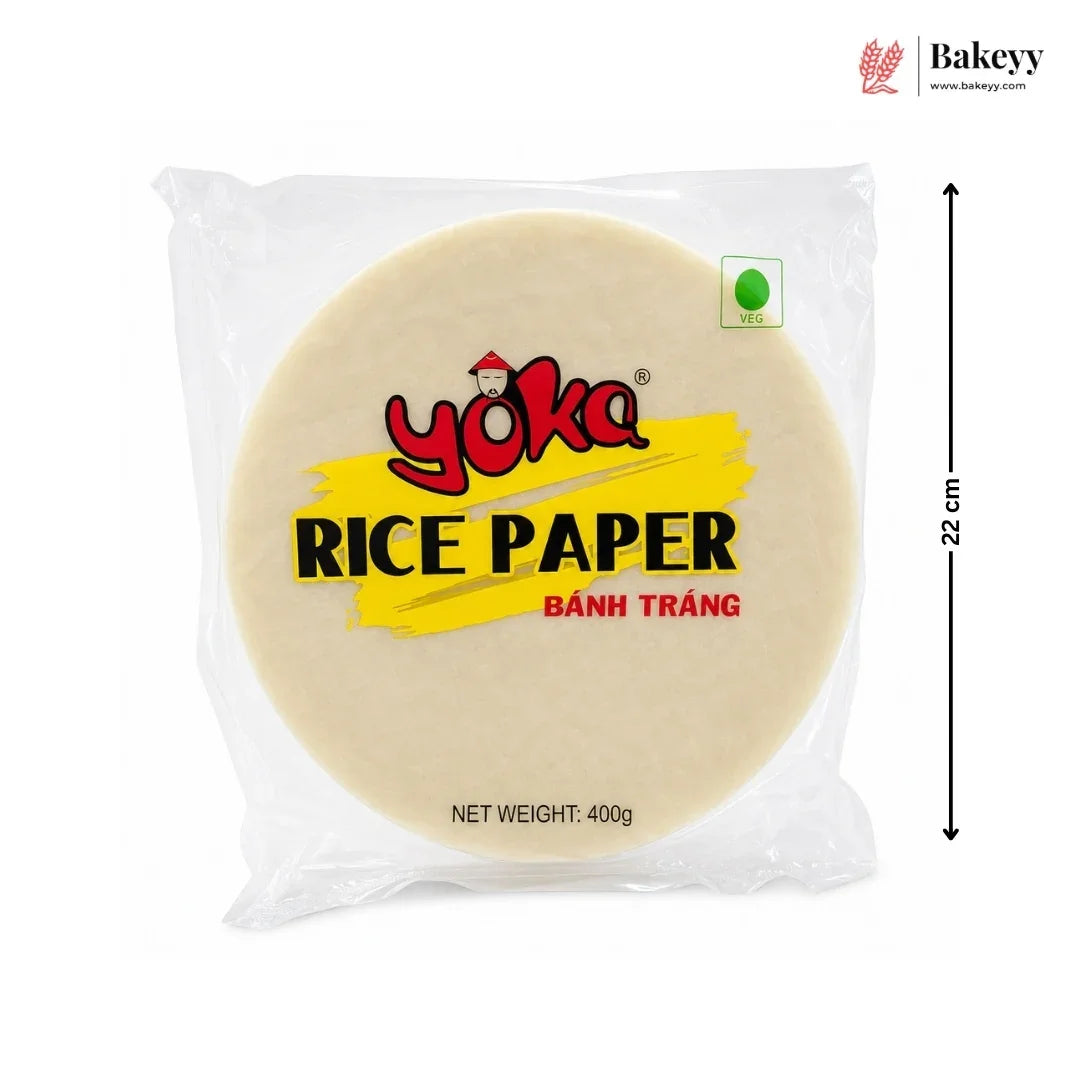 A package of Yoka Rice Paper (Bânh Trâng) on a white background, featuring a black dimension arrow indicating a height of 22 cm. The package contains a round beige rice paper sheet with a yellow and red label.