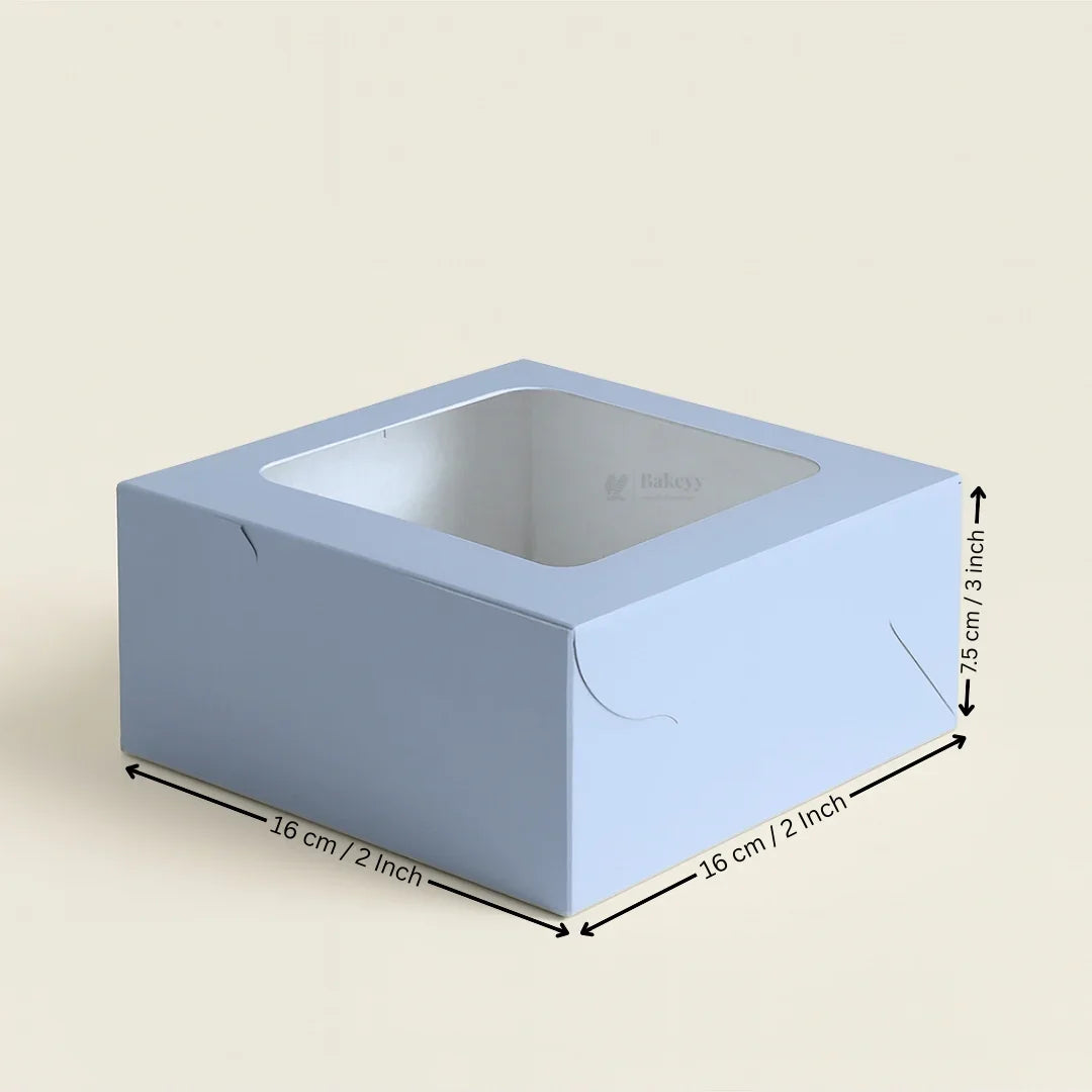 Light blue cupcake box with clear window, 16x16x7.5 cm, ideal for bakery packaging from Bakeyy.
