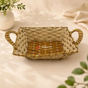 Woven basket with handles on a light background, featuring the brand 'Bakery'.