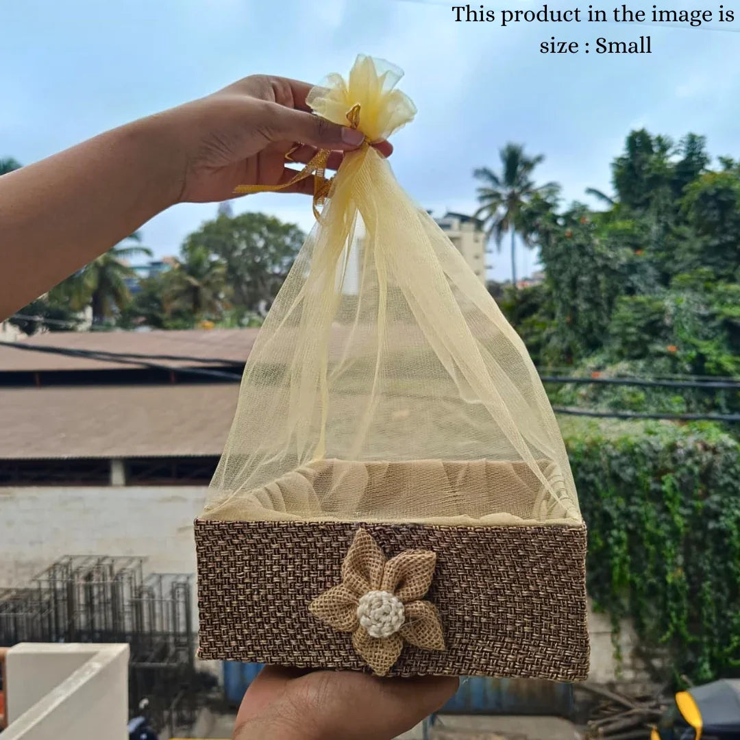 Small net basket with jute flower for gift packaging, held outdoors, Bakeyy baking supplies