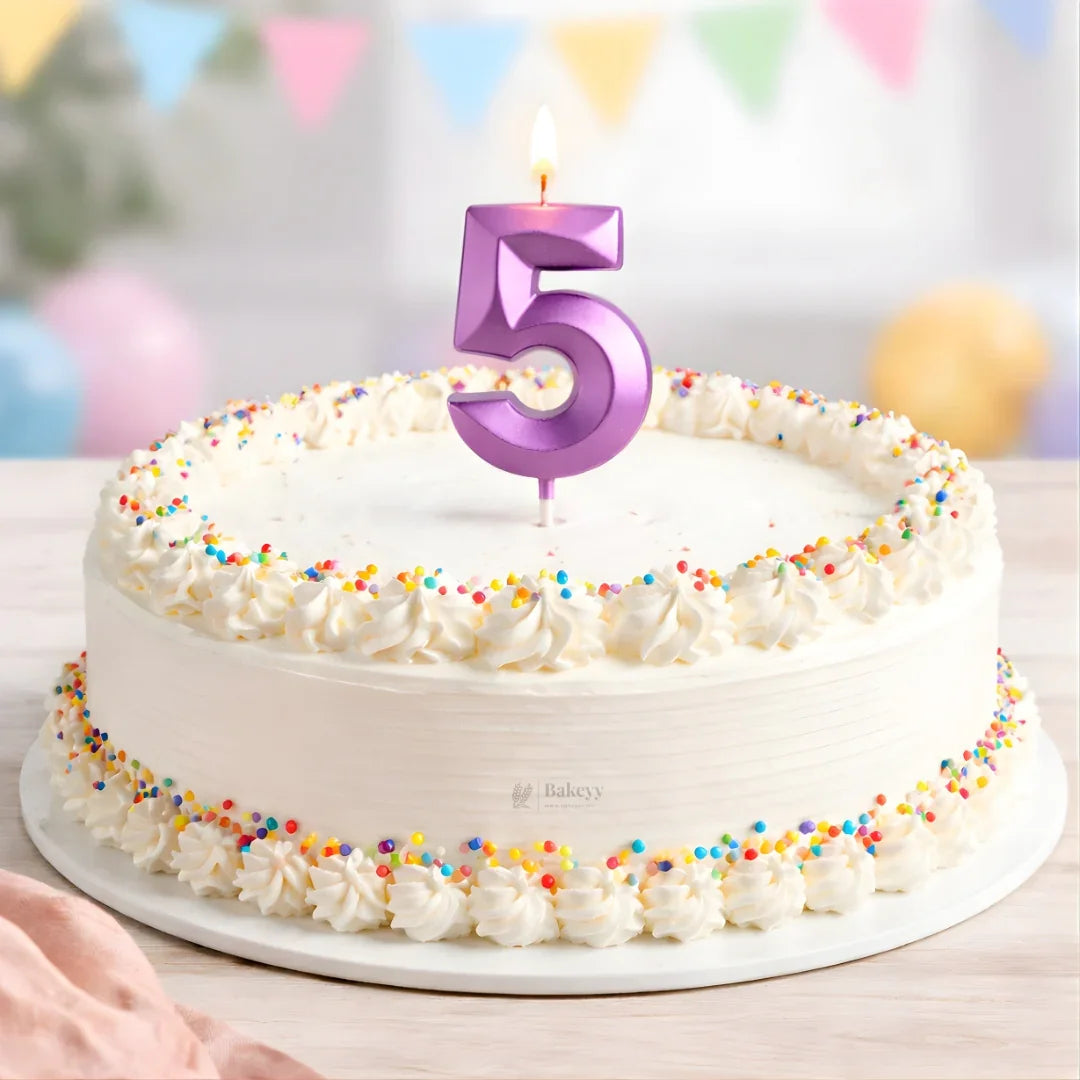 White frosted cake with colorful sprinkles and a purple number 5 candle from Bakeyy.com