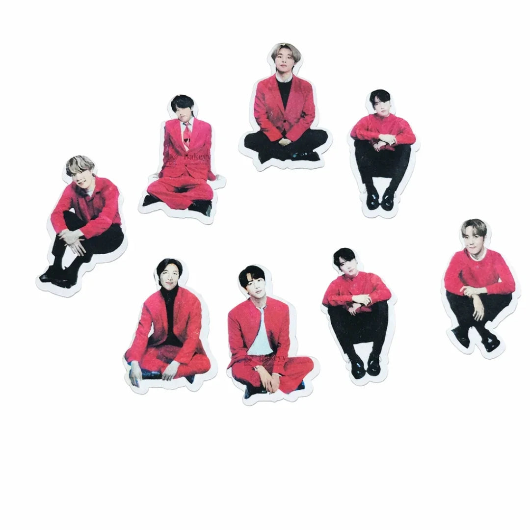 Precut edible wafer toppers of seven men in red outfits, perfect for cakes from Bakeyy.com