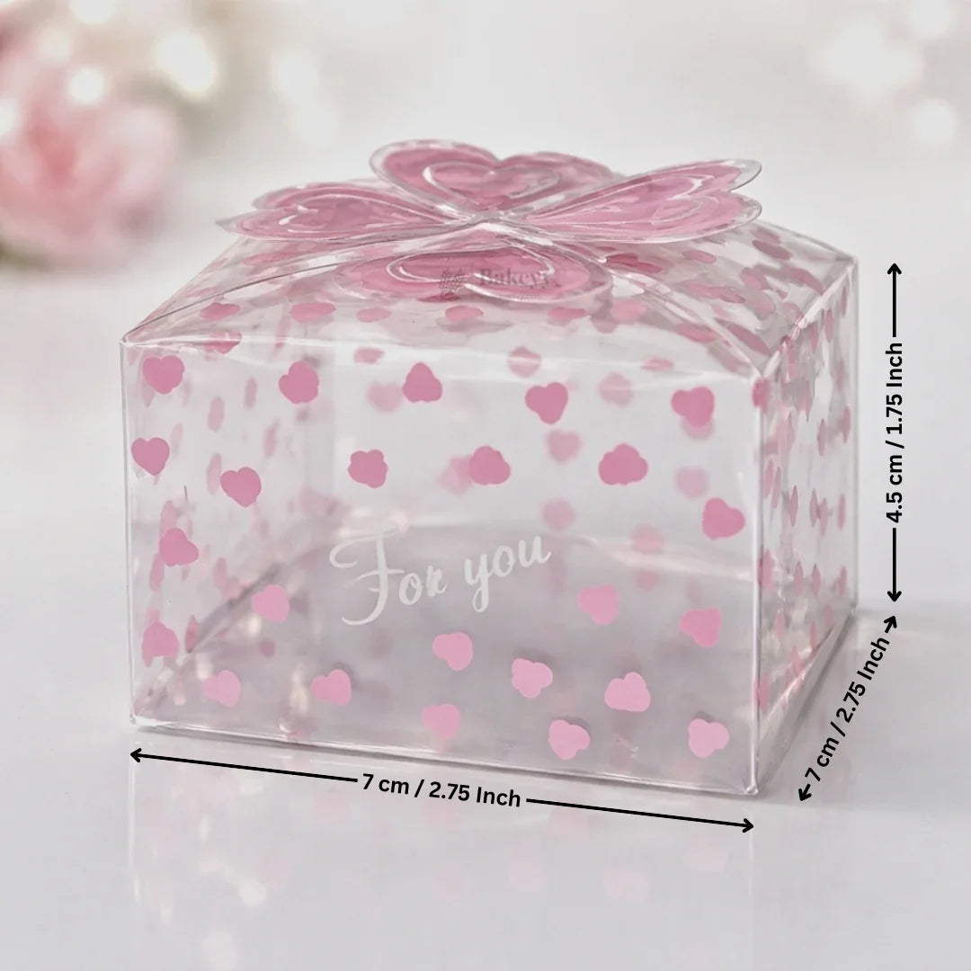 Clear plastic gift box with pink heart pattern, bow lid, and 'For you' text, ideal for bakery packaging from Bakeyy.com