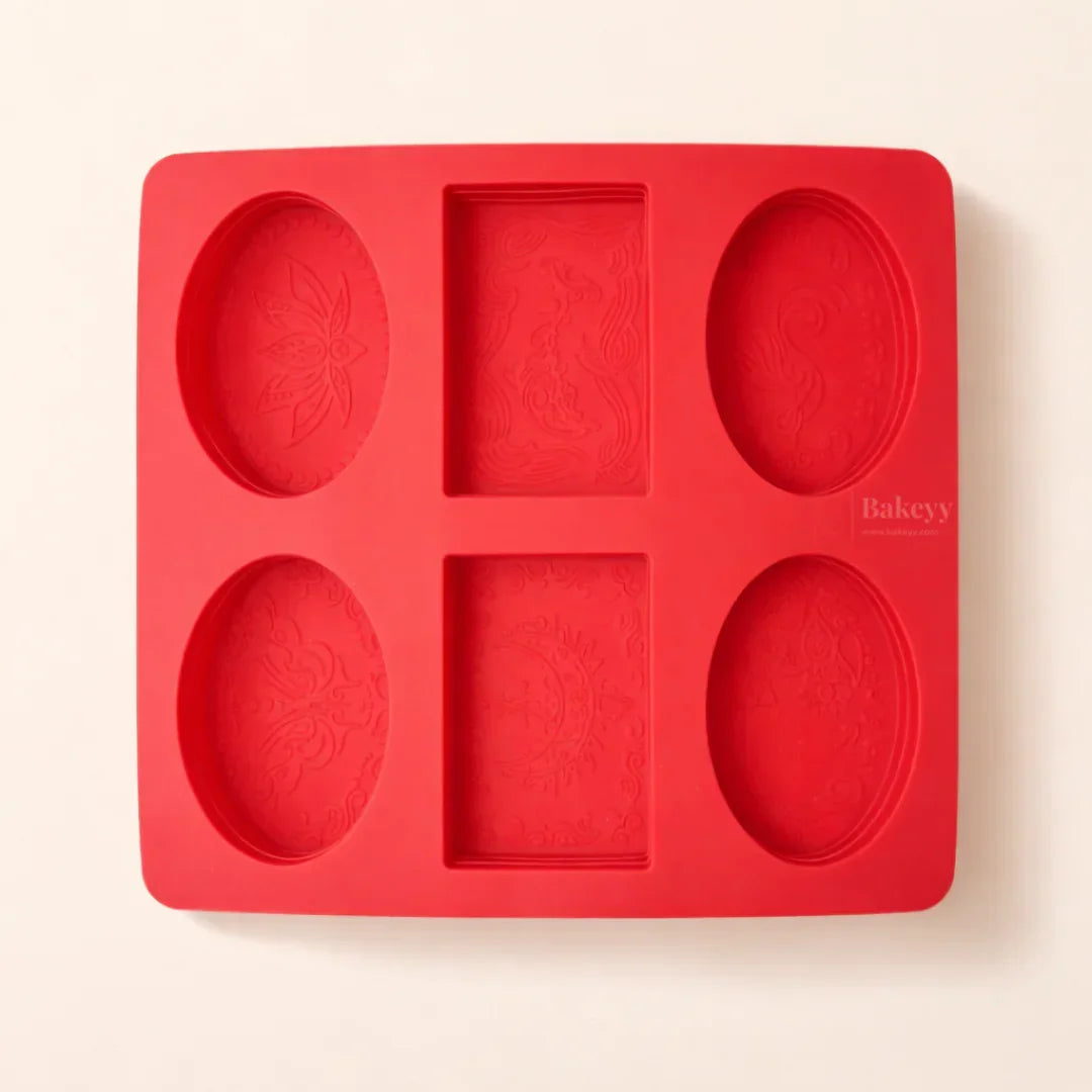 Red silicone soap mould with six cavities and intricate designs, Bakeyy.com baking supplies