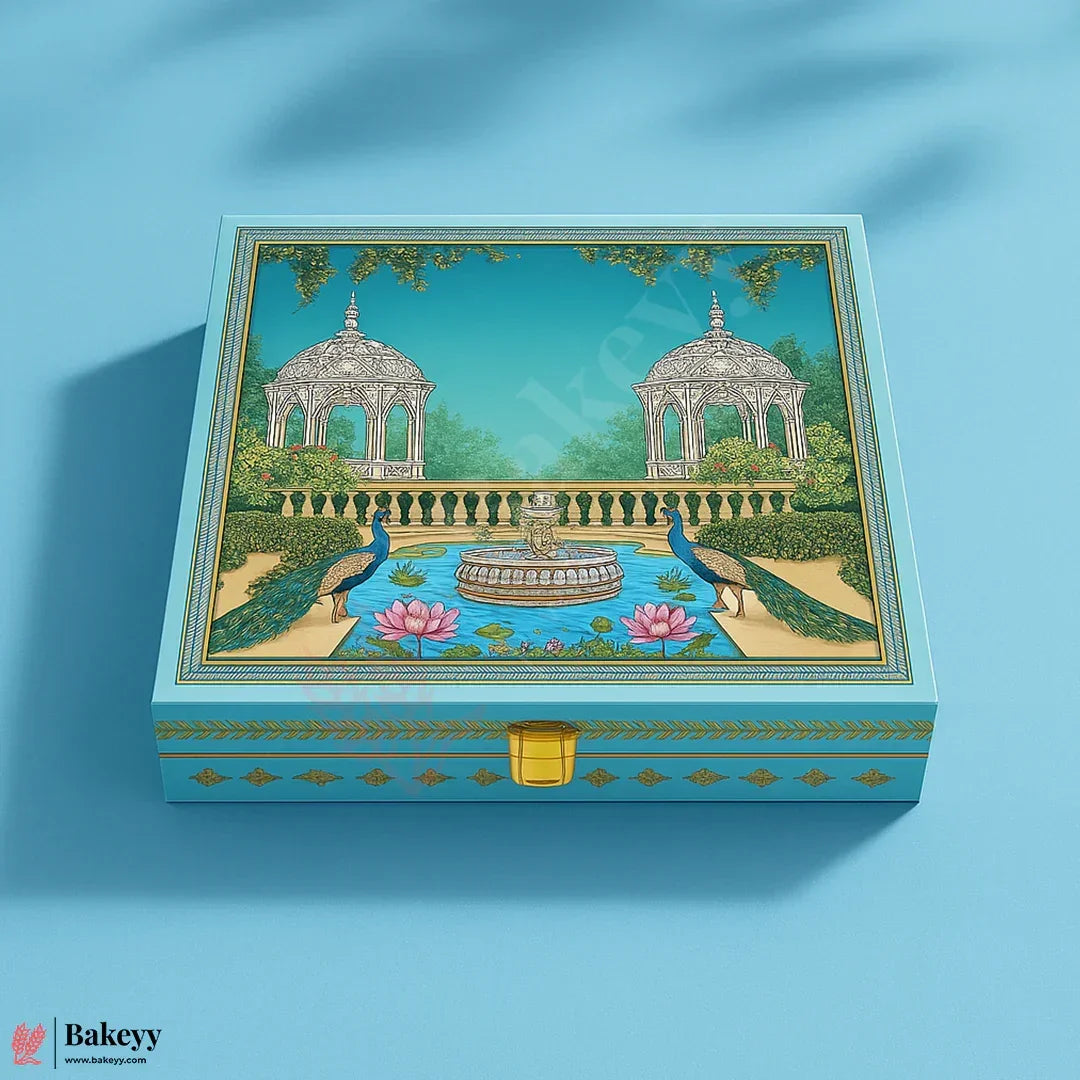 Decorative box with garden design featuring peacocks and a fountain on a blue background