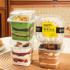 Assorted layered desserts in clear plastic takeaway boxes, perfect for bakery packaging from Bakeyy.com