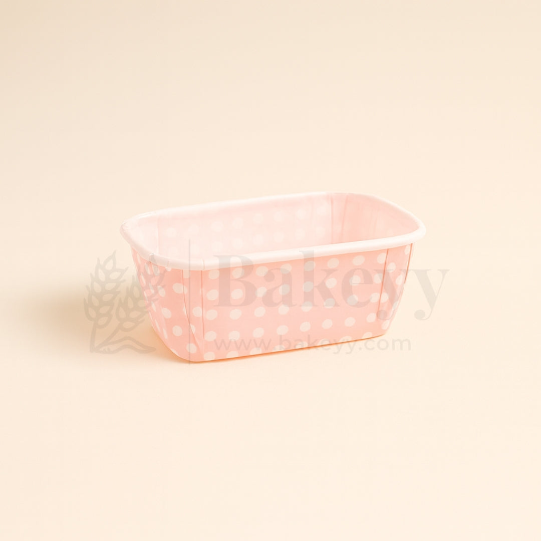 Small pink polka dot container on a beige background