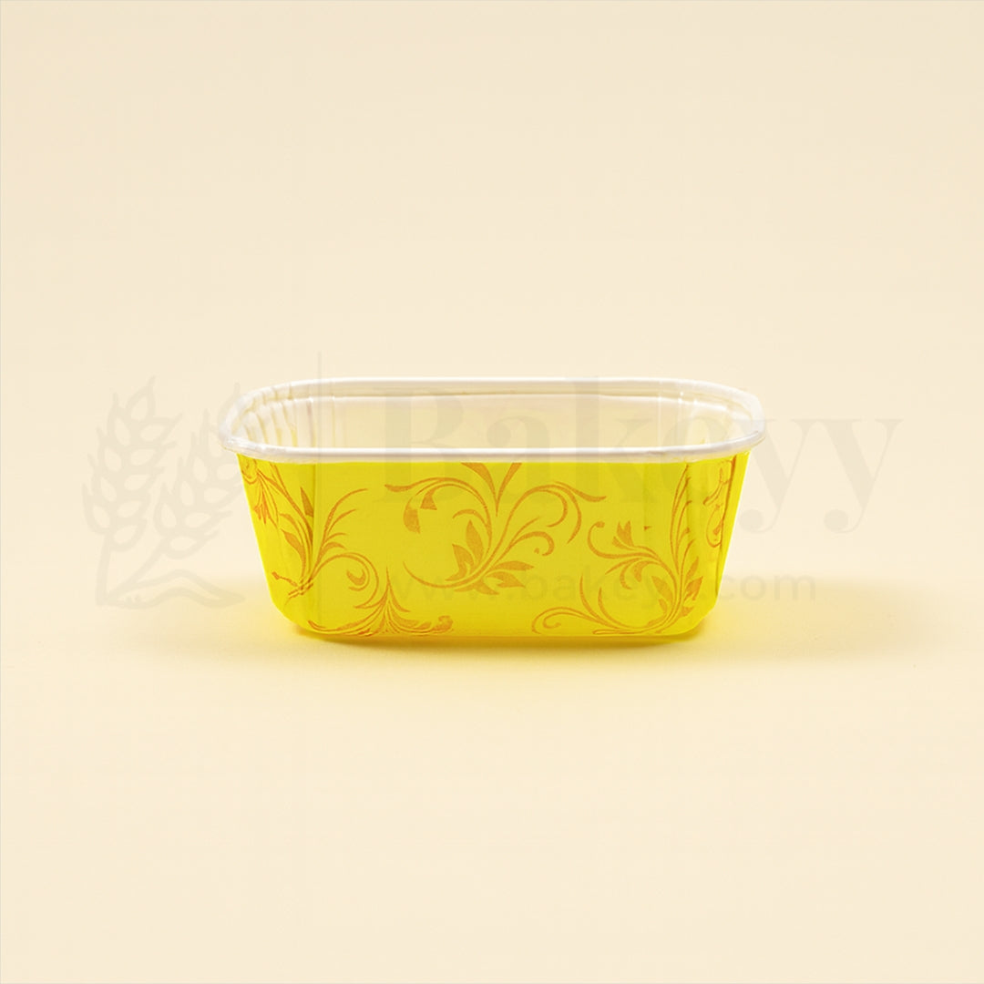 Yellow decorative container with floral patterns on a beige background
